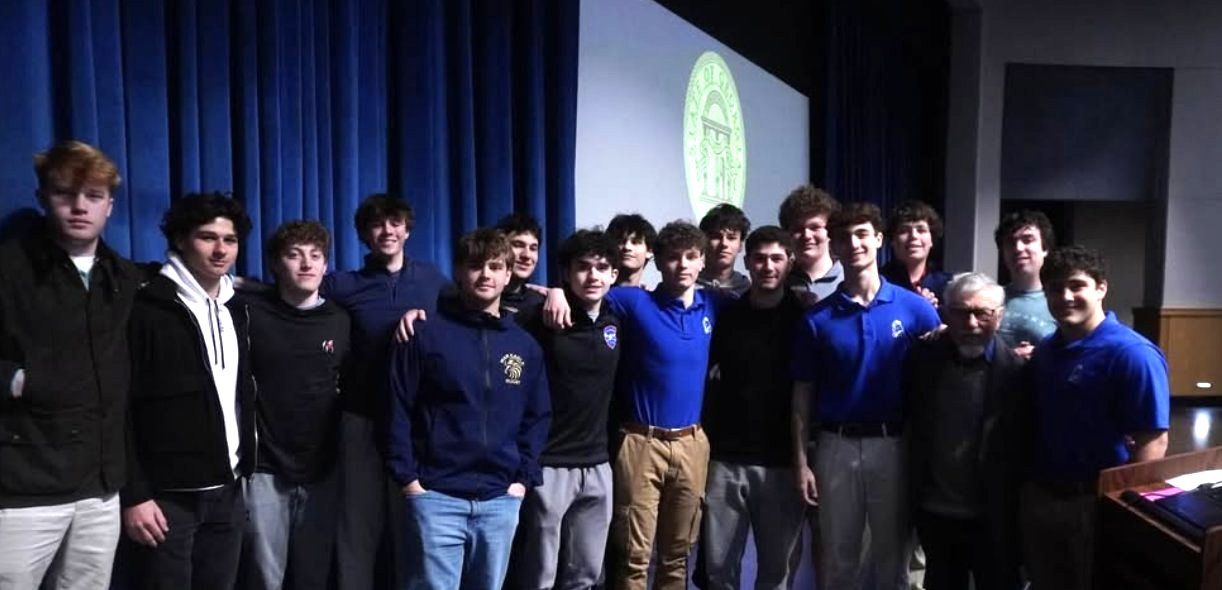 Club members on stage with Holocaust survivor Ben Walker